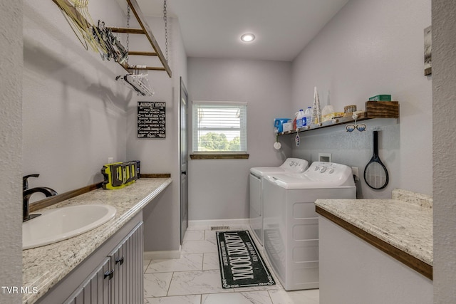 325 Barren Rd, Chuckey, TN 37641 - laundry area with separate washer and dryer, light marble finish floors, and baseboards