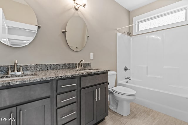 957 Riddle Rdg, Jonesborough, TN 37659 - bathroom featuring toilet, double vanity, and bathtub / shower combination