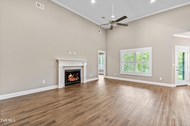 957 Riddle Rdg, Jonesborough, TN 37659 - unfurnished living room with healthy amount of natural light, ceiling fan, ornamental molding, wood finished floors, and baseboards
