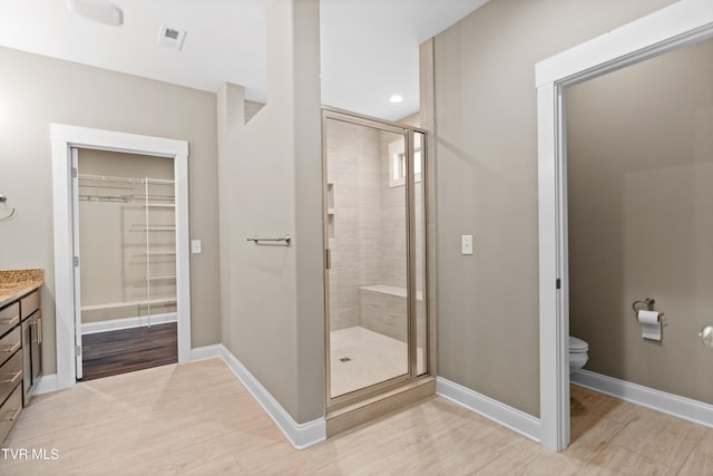 957 Riddle Rdg, Jonesborough, TN 37659 - full bathroom featuring vanity, a shower stall, toilet, a spacious closet, and recessed lighting