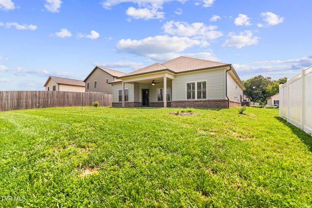 957 Riddle Rdg, Jonesborough, TN 37659 - back of house with a ceiling fan, brick siding, and a shingled roof