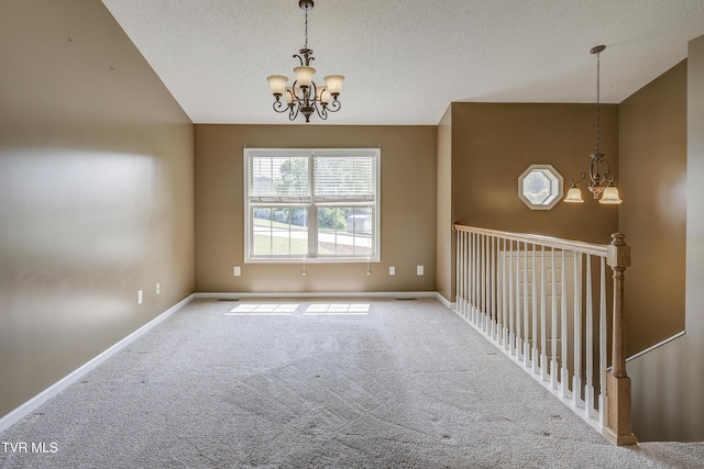 185 Thelma Hannabas Ln, Jonesborough, TN 37659 - empty room featuring a chandelier, carpet floors, a textured ceiling, and baseboards