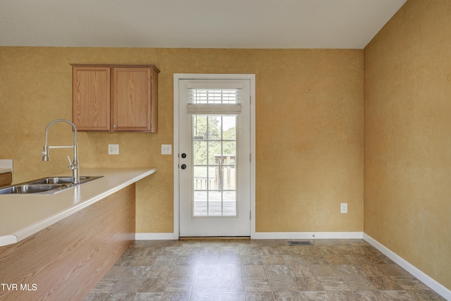 185 Thelma Hannabas Ln, Jonesborough, TN 37659 - kitchen with a sink, baseboards, light countertops, and brown cabinets