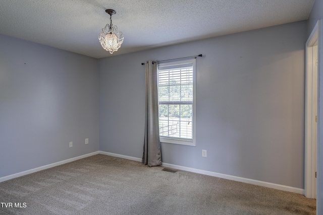 185 Thelma Hannabas Ln, Jonesborough, TN 37659 - unfurnished room featuring carpet floors, a chandelier, baseboards, and a textured ceiling