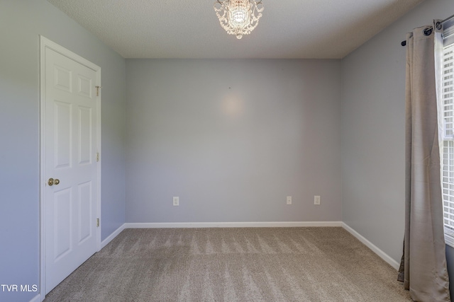 185 Thelma Hannabas Ln, Jonesborough, TN 37659 - carpeted spare room featuring baseboards and a chandelier