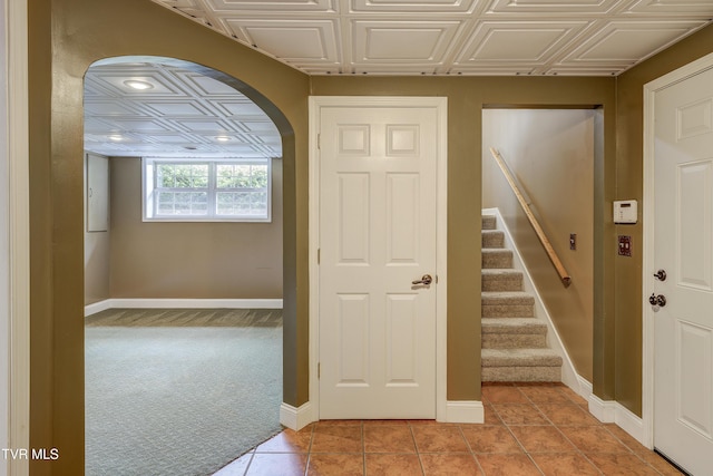 185 Thelma Hannabas Ln, Jonesborough, TN 37659 - hallway with an ornate ceiling, baseboards, light colored carpet, arched walkways, and light tile patterned floors