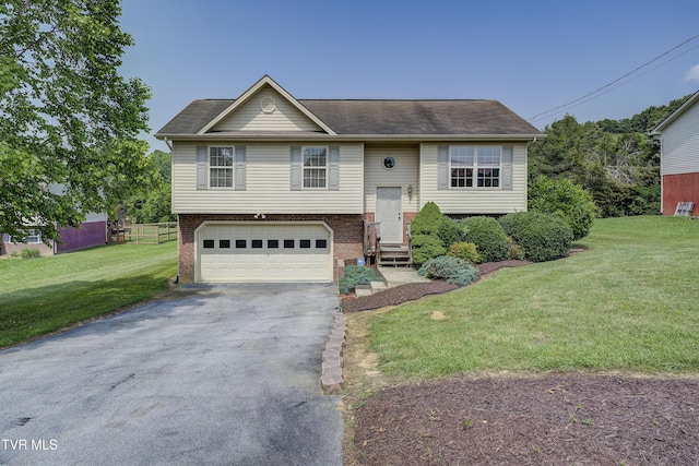 185 Thelma Hannabas Ln, Jonesborough, TN 37659 - raised ranch featuring driveway, a garage, and brick siding