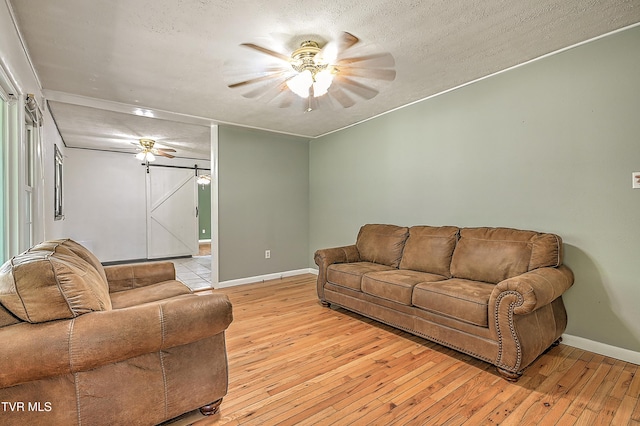 125 Cedar Valley Rd, Bristol, TN 37620 - living room with ceiling fan, baseboards, and light wood-style flooring