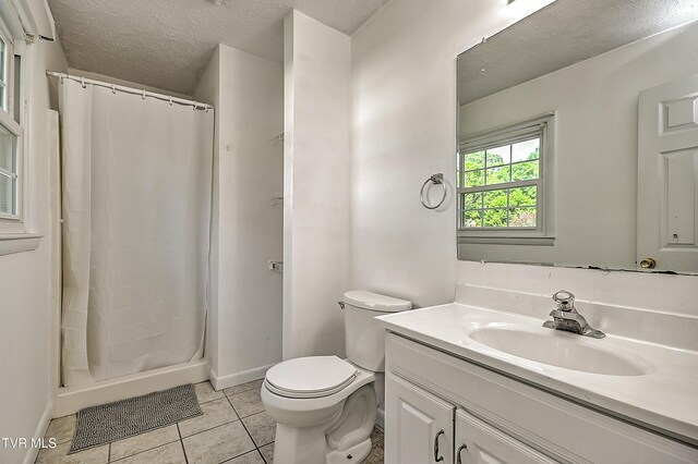 125 Cedar Valley Rd, Bristol, TN 37620 - full bathroom with vanity, toilet, tile patterned flooring, a stall shower, and baseboards