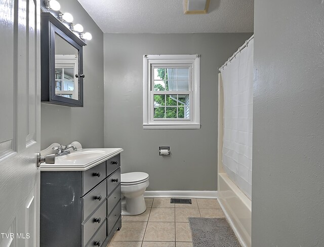 125 Cedar Valley Rd, Bristol, TN 37620 - full bath with vanity, toilet, tile patterned floors, a textured ceiling, and shower / bath combo