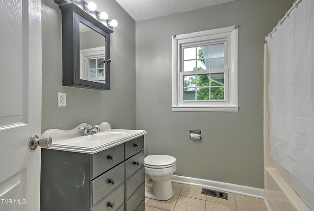 125 Cedar Valley Rd, Bristol, TN 37620 - full bathroom featuring vanity, tile patterned floors, toilet, baseboards, and shower / bath combo