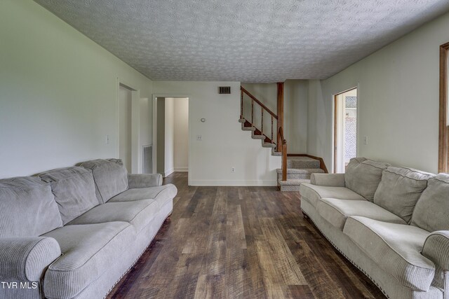 715 Powder Branch Rd, Elizabethton, TN 37643 - living area with dark wood-style flooring, stairway, a textured ceiling, and baseboards