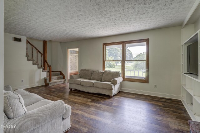 715 Powder Branch Rd, Elizabethton, TN 37643 - living area featuring stairway, wood finished floors, baseboards, and a textured ceiling