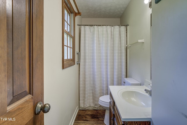 715 Powder Branch Rd, Elizabethton, TN 37643 - bathroom with toilet, wood finished floors, a textured ceiling, vanity, and baseboards