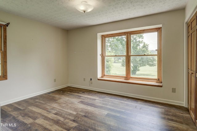 715 Powder Branch Rd, Elizabethton, TN 37643 - spare room with dark wood-style flooring, baseboards, and a textured ceiling