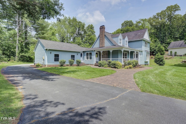 715 Powder Branch Rd, Elizabethton, TN 37643 - view of front of property with a chimney, a porch, a front yard, and driveway