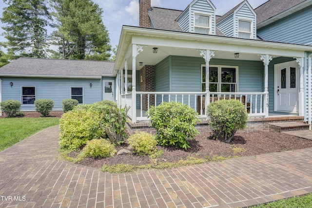 715 Powder Branch Rd, Elizabethton, TN 37643 - view of front of home featuring a chimney, a porch, and a shingled roof