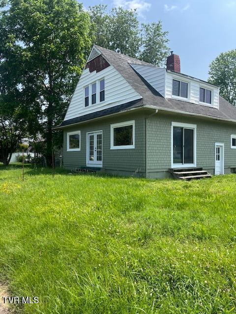 534 Ohio Ave, Erwin, TN 37650 - back of property with french doors, a chimney, a shingled roof, and entry steps