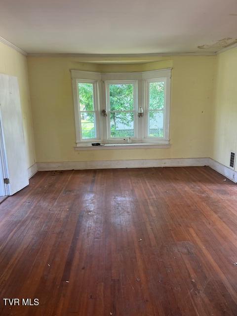534 Ohio Ave, Erwin, TN 37650 - empty room featuring wood-type flooring, ornamental molding, and baseboards