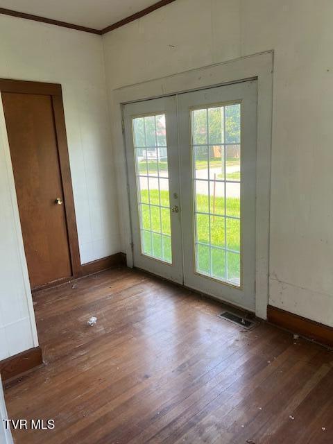 534 Ohio Ave, Erwin, TN 37650 - unfurnished room with french doors, hardwood / wood-style floors, baseboards, and ornamental molding