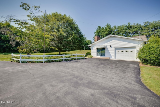 396 High Cir, Bristol, TN 37620 - view of front of home with a chimney, asphalt driveway, and view of scattered trees