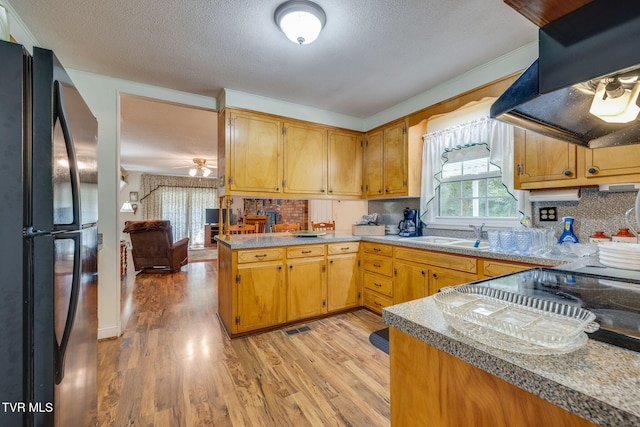 396 High Cir, Bristol, TN 37620 - kitchen featuring freestanding refrigerator, extractor fan, a ceiling fan, light wood-style flooring, and a textured ceiling