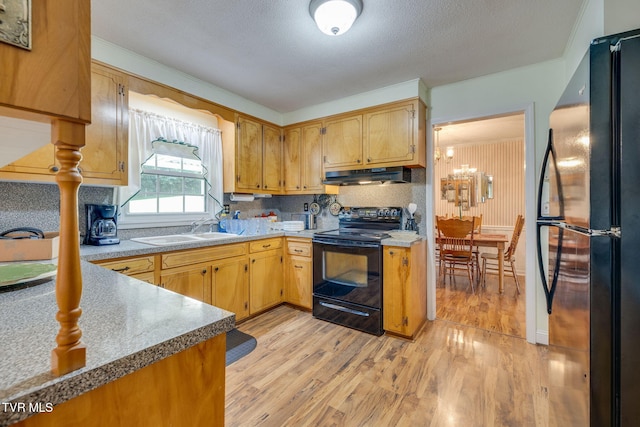 396 High Cir, Bristol, TN 37620 - kitchen featuring black appliances, under cabinet range hood, light wood-style floors, a textured ceiling, and light countertops