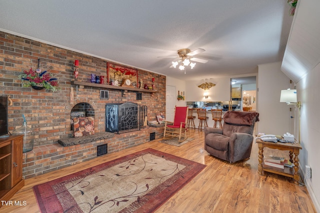 396 High Cir, Bristol, TN 37620 - living room featuring wood finished floors, ceiling fan, and a fireplace