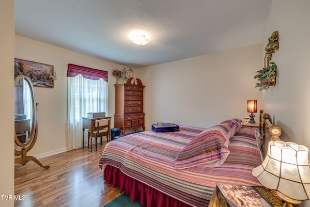 396 High Cir, Bristol, TN 37620 - bedroom featuring wood finished floors and baseboards