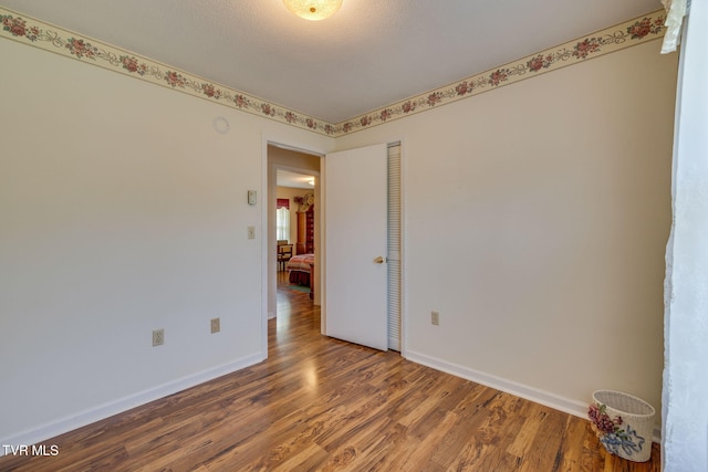396 High Cir, Bristol, TN 37620 - empty room featuring wood finished floors and baseboards