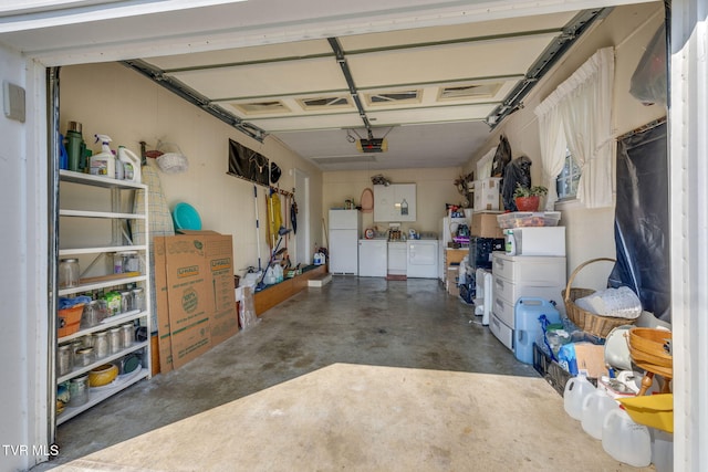 396 High Cir, Bristol, TN 37620 - garage featuring freestanding refrigerator, separate washer and dryer, and a garage door opener