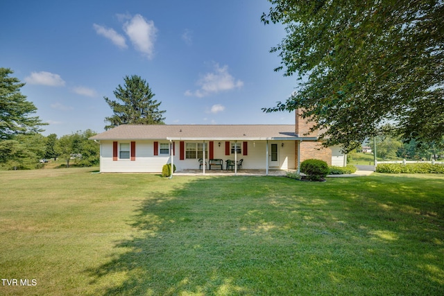 396 High Cir, Bristol, TN 37620 - view of front of home featuring a front lawn, a chimney, and a patio