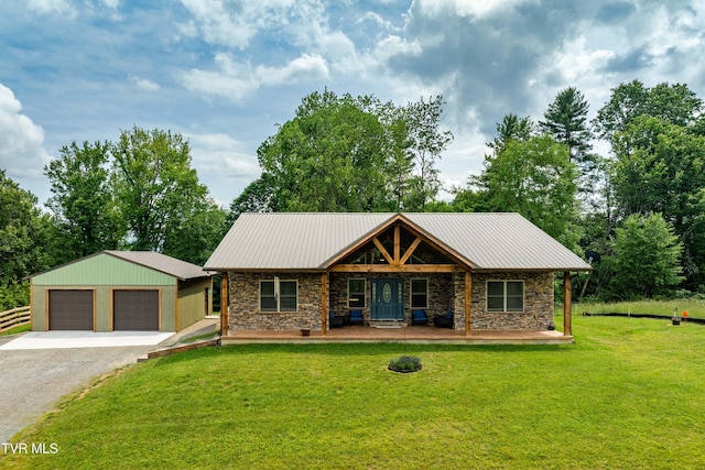 271 Laurel Way, Mountain City, TN 37683 - view of front of home featuring stone siding, a front lawn, a detached garage, and a porch