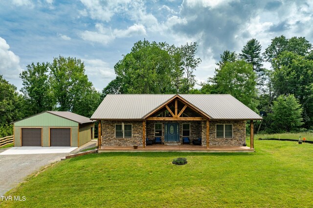 271 Laurel Way, Mountain City, TN 37683 - view of front of home featuring stone siding, a front lawn, a detached garage, and a porch
