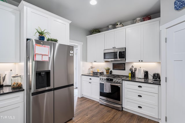 271 Laurel Way, Mountain City, TN 37683 - kitchen with stainless steel appliances, dark wood-type flooring, white cabinetry, recessed lighting, and dark stone counters