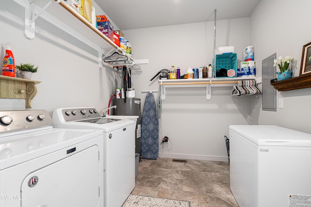 271 Laurel Way, Mountain City, TN 37683 - washroom featuring washing machine and clothes dryer, water heater, stone finish flooring, and baseboards