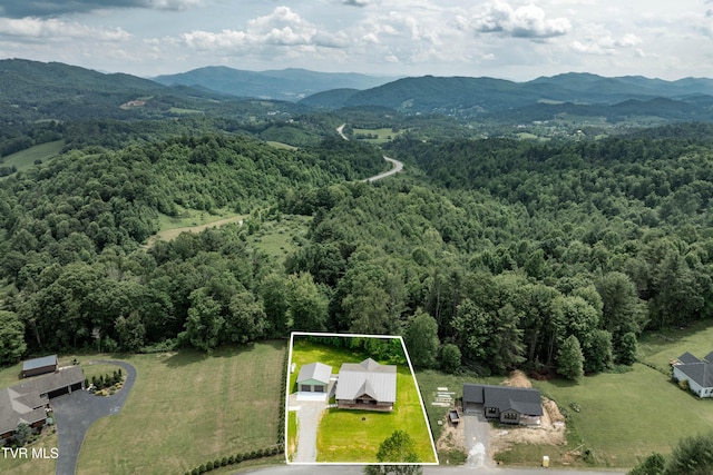 271 Laurel Way, Mountain City, TN 37683 - aerial view of property and surrounding area featuring a heavily wooded area, a mountain backdrop, and property parcel outlined