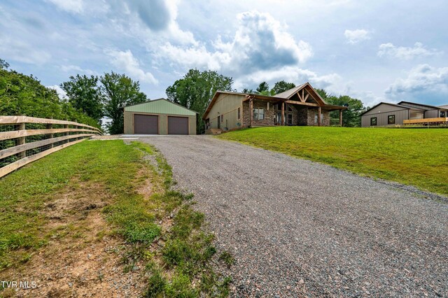 271 Laurel Way, Mountain City, TN 37683 - view of front of home featuring an outbuilding, stone siding, and a garage