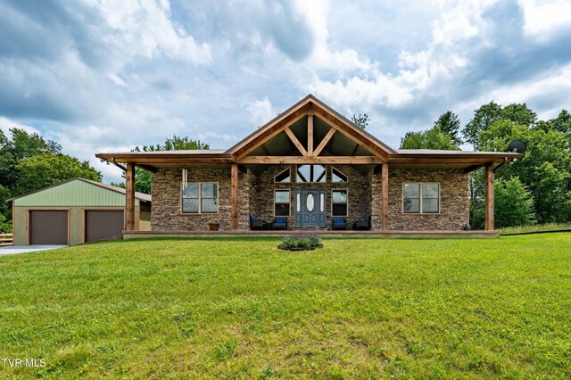 271 Laurel Way, Mountain City, TN 37683 - rear view of property featuring stone siding, a yard, an outdoor structure, and a detached garage