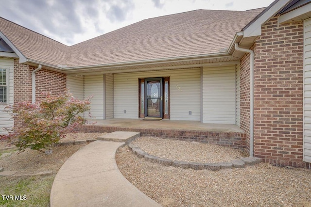 229 Ridgecrest Rd, Jonesborough, TN 37659 - property entrance with a shingled roof, covered porch, and brick siding