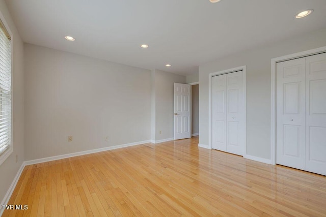 229 Ridgecrest Rd, Jonesborough, TN 37659 - unfurnished bedroom featuring multiple closets, light wood-style flooring, baseboards, and recessed lighting