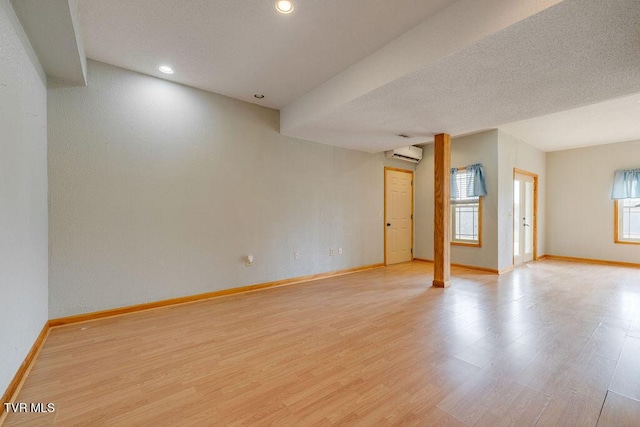 229 Ridgecrest Rd, Jonesborough, TN 37659 - empty room featuring baseboards, light wood-style floors, a wall unit AC, plenty of natural light, and recessed lighting