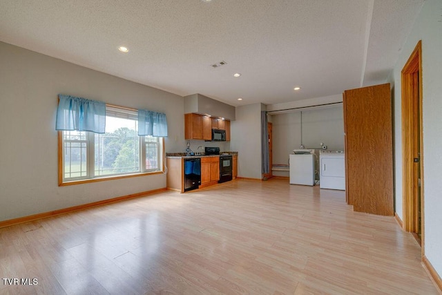 229 Ridgecrest Rd, Jonesborough, TN 37659 - unfurnished living room featuring washer and dryer, a textured ceiling, baseboards, light wood-style flooring, and recessed lighting