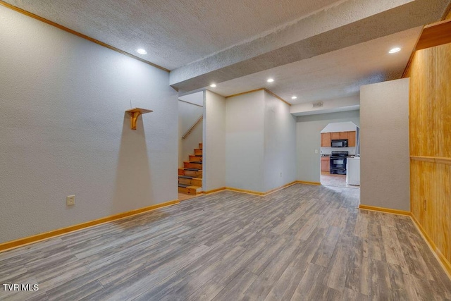 229 Ridgecrest Rd, Jonesborough, TN 37659 - unfurnished living room with wood finished floors, baseboards, recessed lighting, a textured ceiling, and stairs
