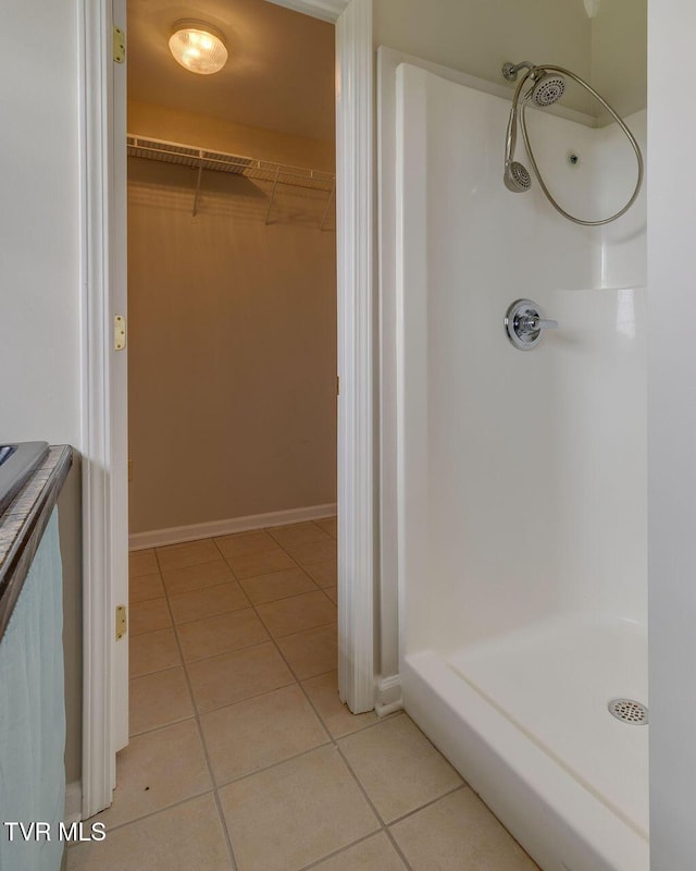 229 Ridgecrest Rd, Jonesborough, TN 37659 - full bathroom featuring a stall shower, tile patterned flooring, a walk in closet, and baseboards