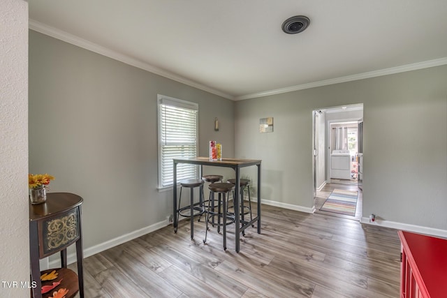 105 Crossway Rd, Bristol, VA 24201 - dining room featuring plenty of natural light, crown molding, wood finished floors, and baseboards
