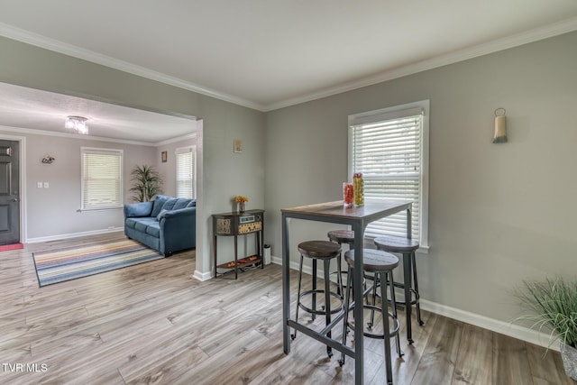 105 Crossway Rd, Bristol, VA 24201 - dining room featuring baseboards, wood finished floors, and ornamental molding