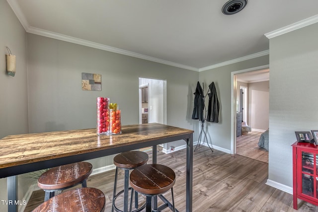 105 Crossway Rd, Bristol, VA 24201 - dining area featuring wood finished floors, ornamental molding, and baseboards