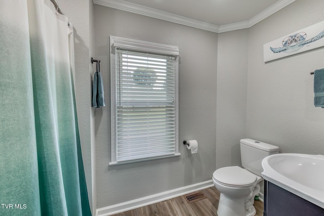 105 Crossway Rd, Bristol, VA 24201 - bathroom with wood finished floors, crown molding, vanity, toilet, and baseboards