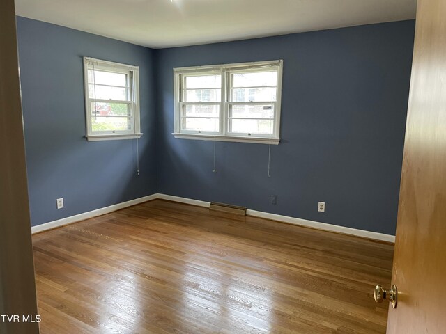 201 Brown St, Appalachia, VA 24216 - unfurnished room with wood finished floors and baseboards